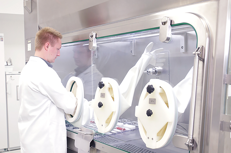 Franz Ziel: working at a flexible laboratory isolator (FLI)