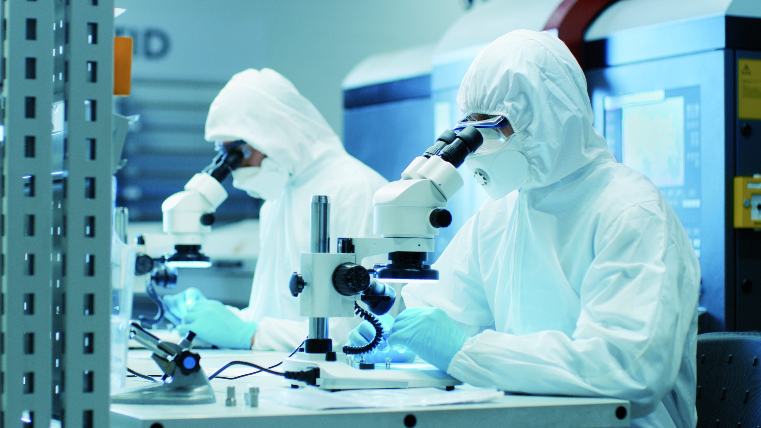 Two Engineers/ Scientists/ Technicians in Sterile Cleanroom Suit