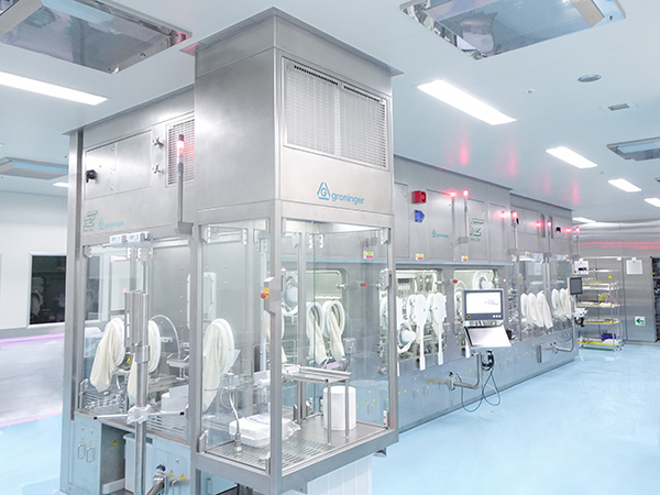 flexfill Filling and closing machine with isolator, made by groninger and Franz Ziel